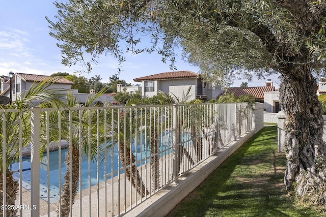 view of swimming pool featuring a water view