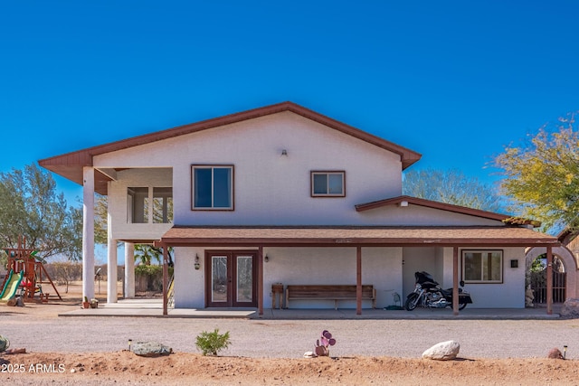 back of house featuring a patio area and french doors