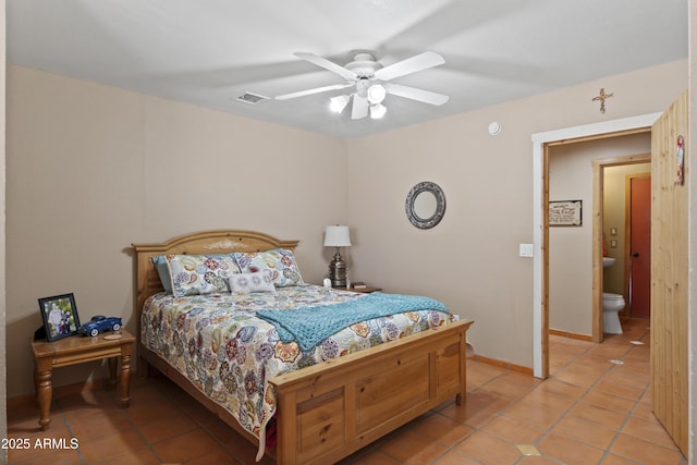 bedroom with ceiling fan and light tile patterned floors