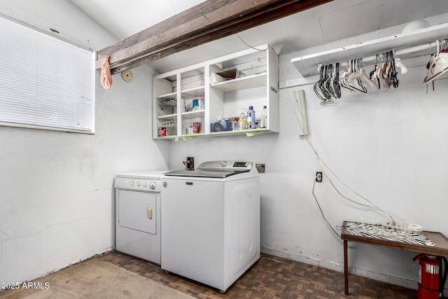 washroom with washing machine and dryer