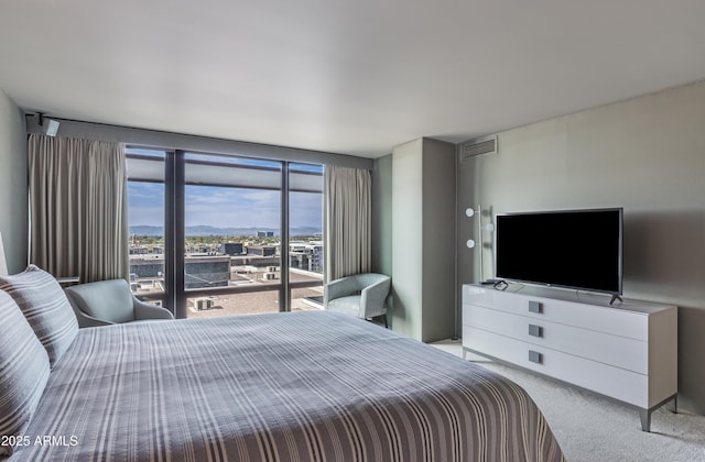 bedroom featuring carpet and visible vents