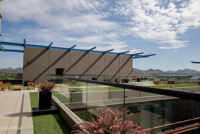 balcony featuring a mountain view