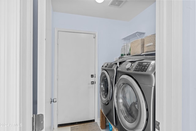 clothes washing area with independent washer and dryer
