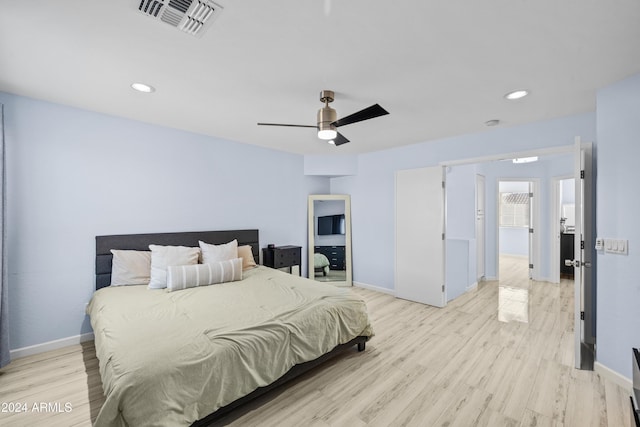 bedroom with baseboards, light wood finished floors, ceiling fan, and recessed lighting