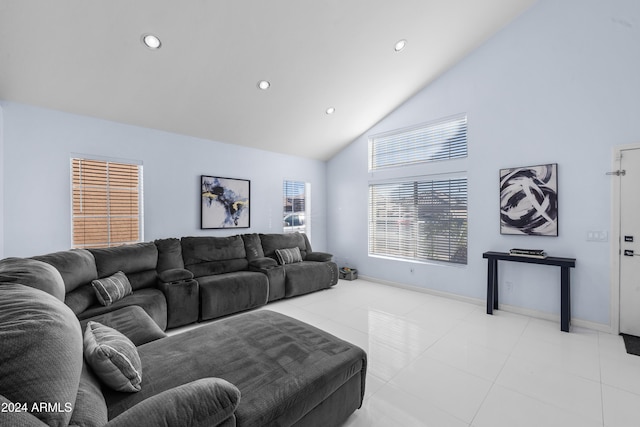 living room featuring high vaulted ceiling, recessed lighting, baseboards, and light tile patterned floors
