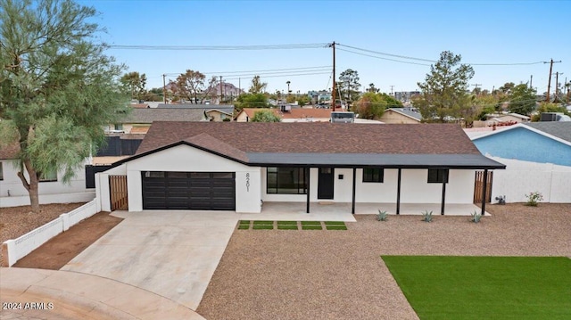 view of front facade with a front lawn and a garage