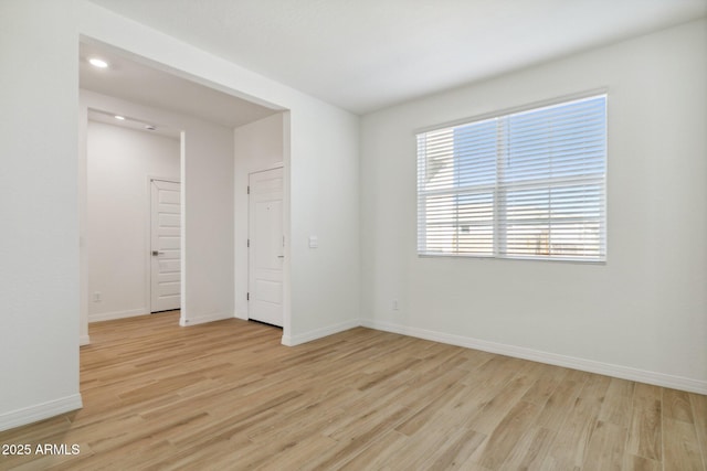 unfurnished room featuring light wood-type flooring