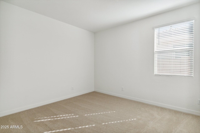 unfurnished room with carpet floors