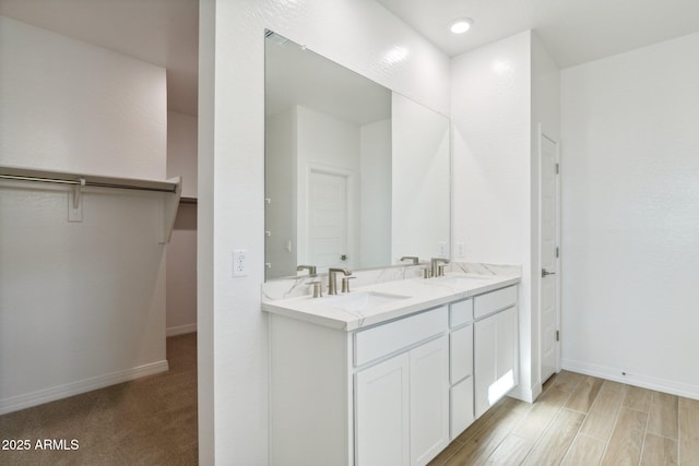 bathroom featuring vanity and hardwood / wood-style floors