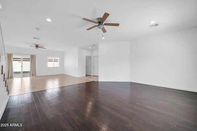 unfurnished room with recessed lighting, visible vents, baseboards, and wood finished floors