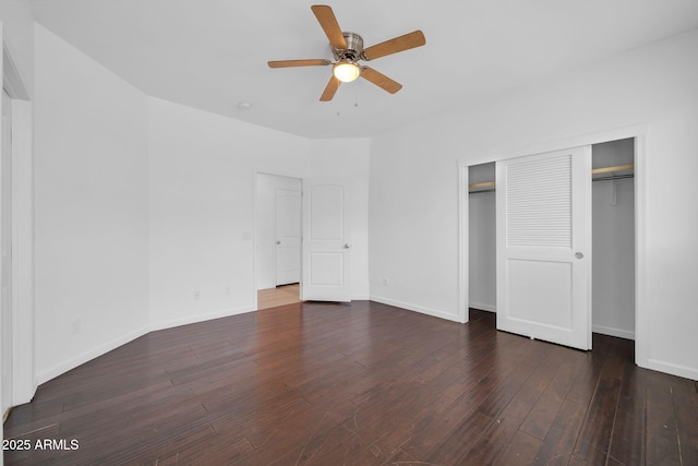 unfurnished bedroom with a ceiling fan, a closet, baseboards, and wood finished floors