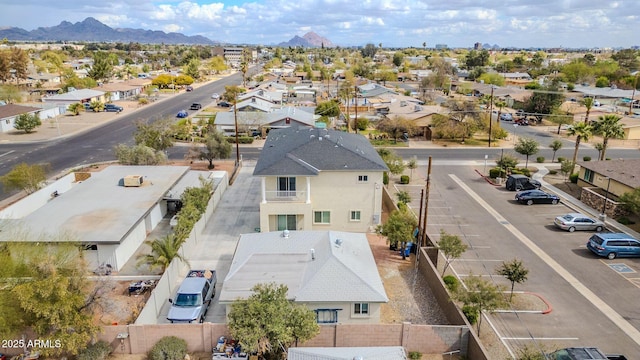 drone / aerial view featuring a residential view and a mountain view