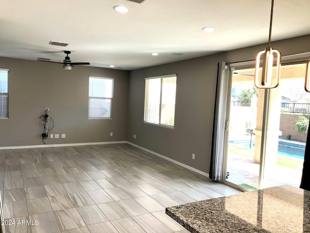 interior space featuring ceiling fan and light hardwood / wood-style flooring