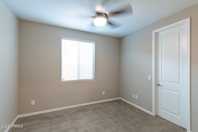 empty room with light carpet and ceiling fan