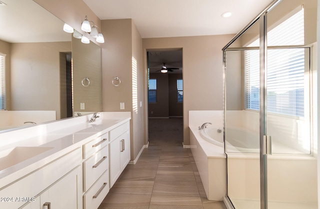 bathroom with ceiling fan, vanity, plus walk in shower, and tile patterned floors