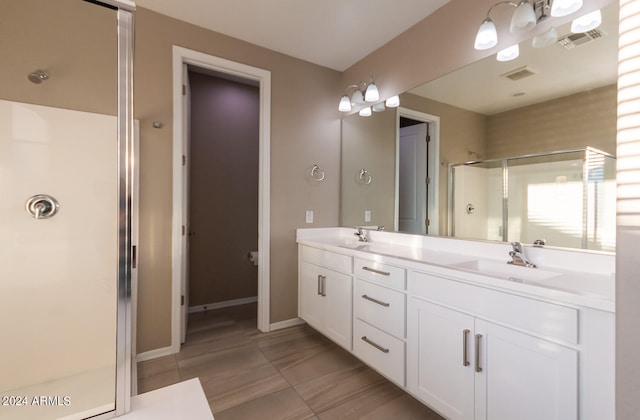 bathroom featuring walk in shower and vanity