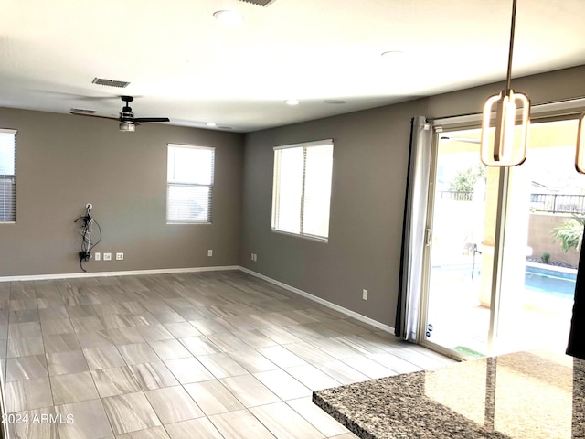 interior space with light hardwood / wood-style floors and ceiling fan