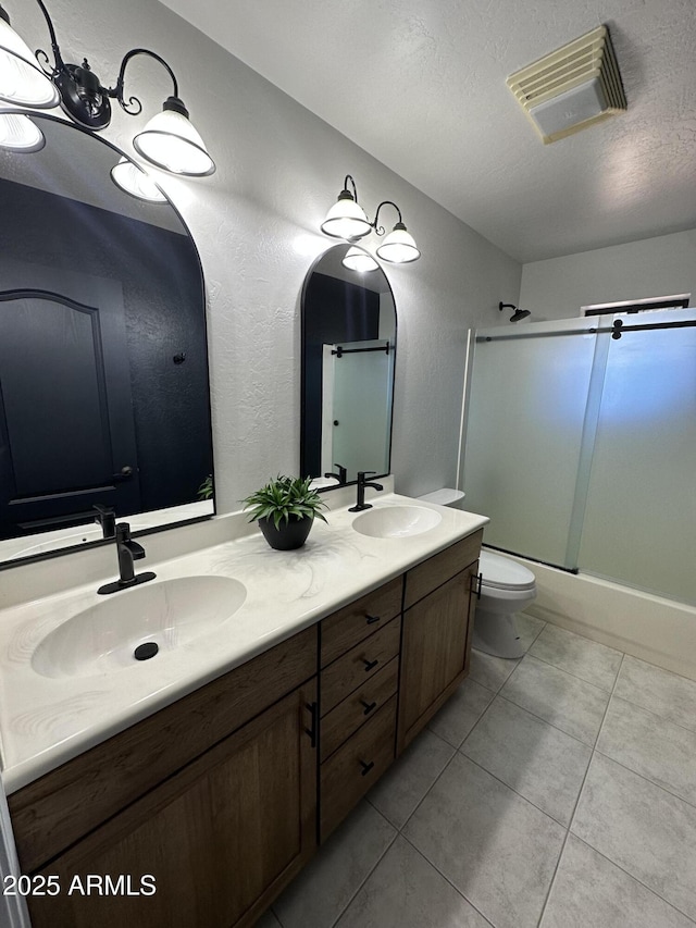 full bathroom featuring tile patterned flooring, visible vents, toilet, and a sink