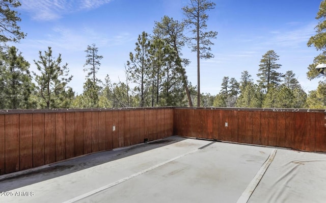 view of patio / terrace featuring fence