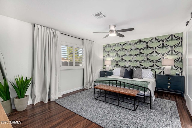 bedroom featuring dark hardwood / wood-style floors and ceiling fan