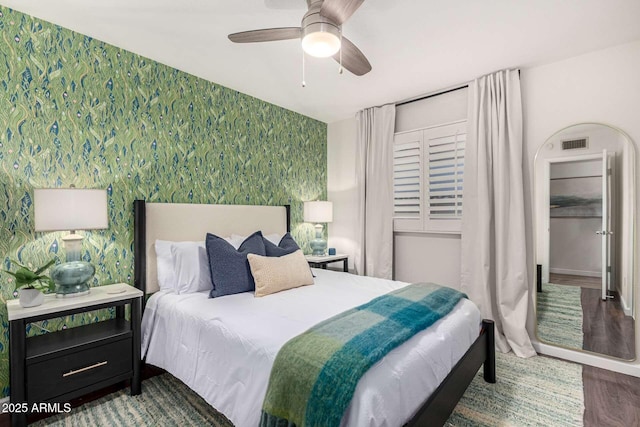 bedroom featuring wood-type flooring and ceiling fan