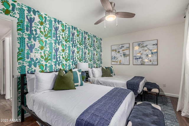 bedroom with ceiling fan and hardwood / wood-style floors