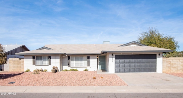 ranch-style house featuring a garage