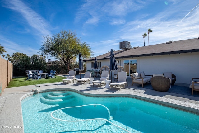 view of swimming pool with an outdoor hangout area, central AC, and a patio