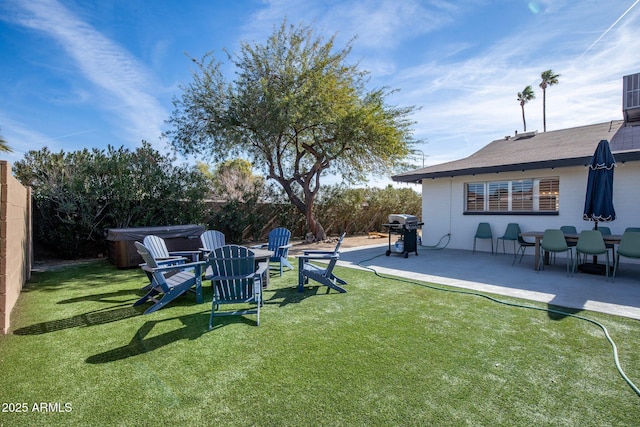 view of yard featuring a patio area and a hot tub