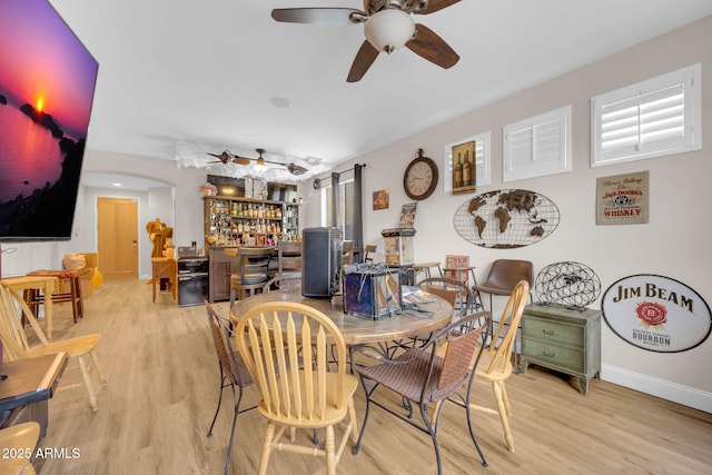10613 E Knowles Ave, Mesa, AZ 85209 - dining room featuring a dry bar, wood finished floors, ceiling fan, and baseboards