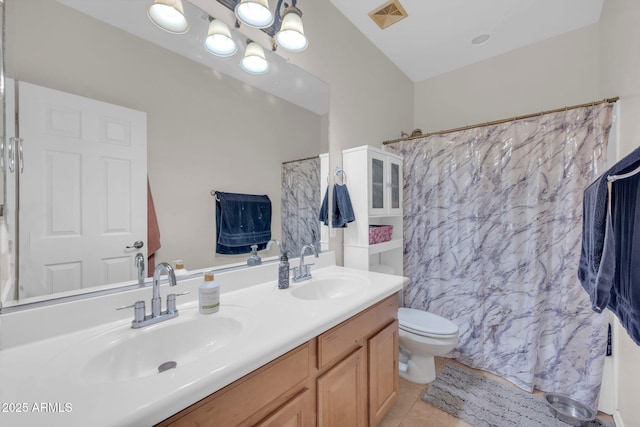 10613 E Knowles Ave, Mesa, AZ 85209 - full bath featuring toilet, double vanity, tile patterned flooring, and a shower with shower curtain