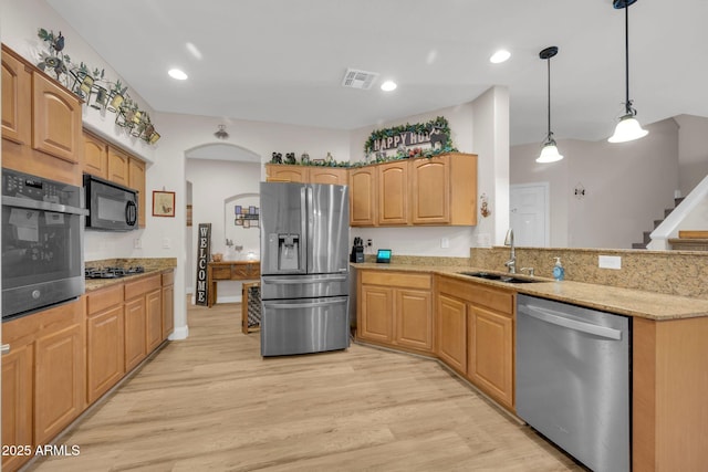 10613 E Knowles Ave, Mesa, AZ 85209 - kitchen featuring black appliances, a sink, light wood finished floors, light stone countertops, and arched walkways