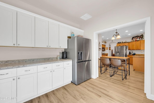 10613 E Knowles Ave, Mesa, AZ 85209 - kitchen featuring stainless steel fridge, light wood finished floors, recessed lighting, a chandelier, and a sink