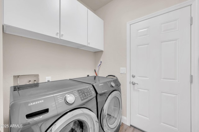 10613 E Knowles Ave, Mesa, AZ 85209 - laundry area with cabinet space, washing machine and clothes dryer, and light wood-style floors