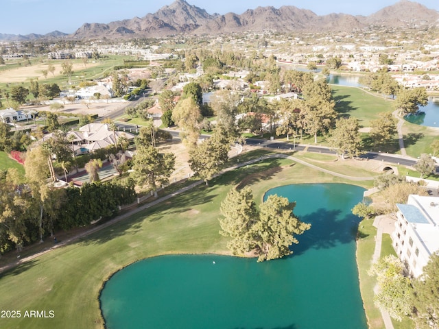 birds eye view of property featuring view of golf course and a water and mountain view