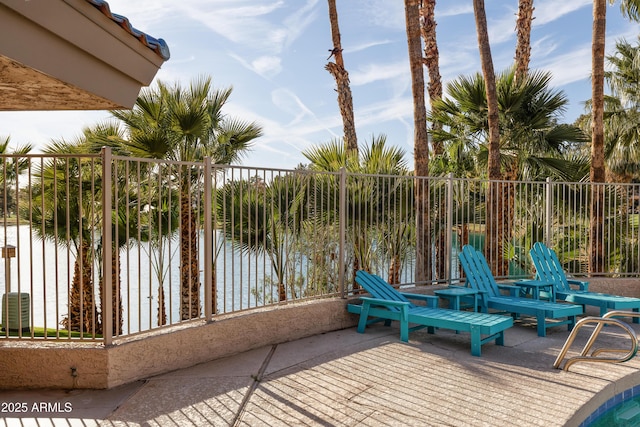 view of patio / terrace featuring fence