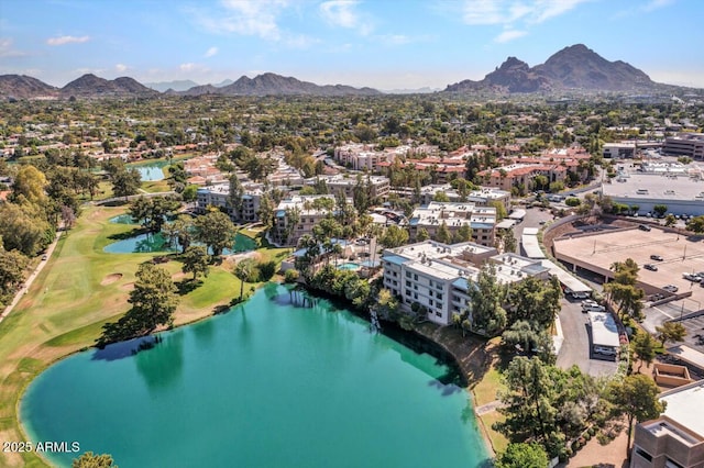 drone / aerial view featuring a water and mountain view