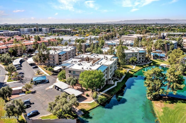 birds eye view of property with a water view