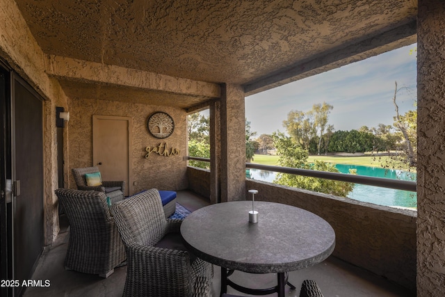 balcony featuring a water view