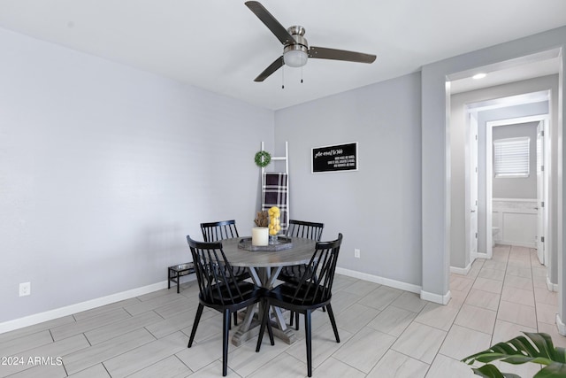 dining room featuring ceiling fan