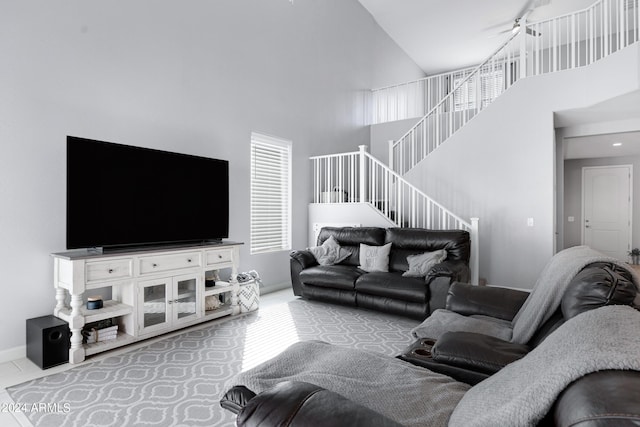 living room featuring a high ceiling