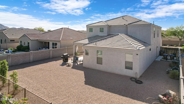 rear view of house with a patio