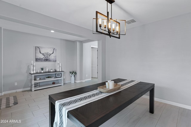 dining area featuring a notable chandelier