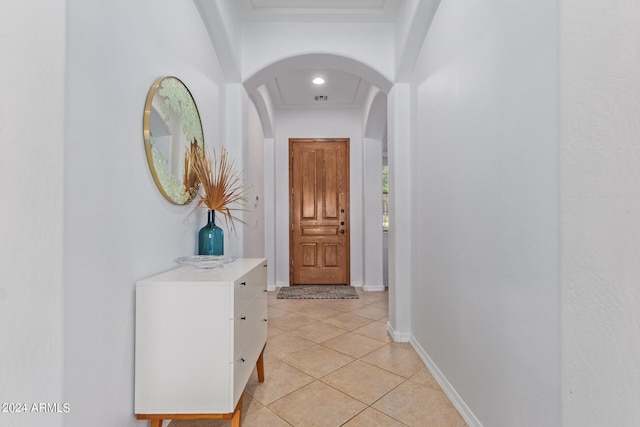 corridor featuring light tile patterned floors