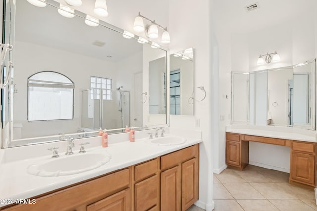 bathroom featuring vanity, tile patterned floors, and an enclosed shower