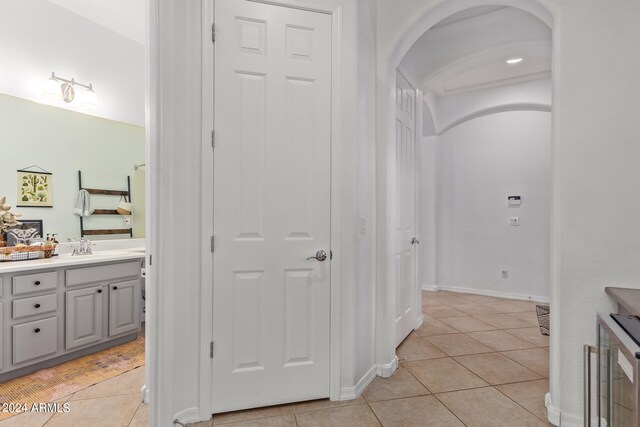 bathroom featuring tile patterned flooring and vanity