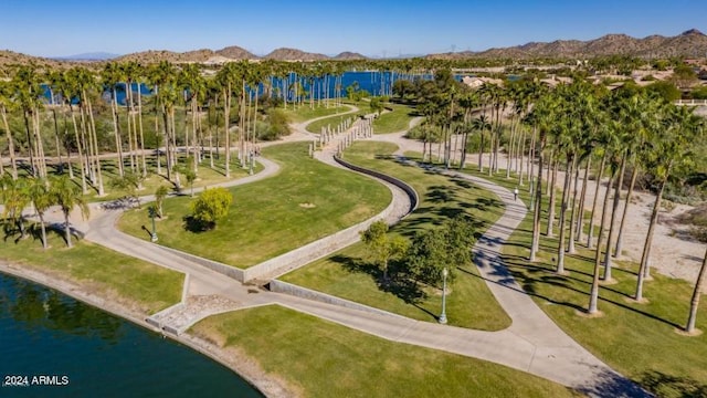 drone / aerial view featuring a water and mountain view