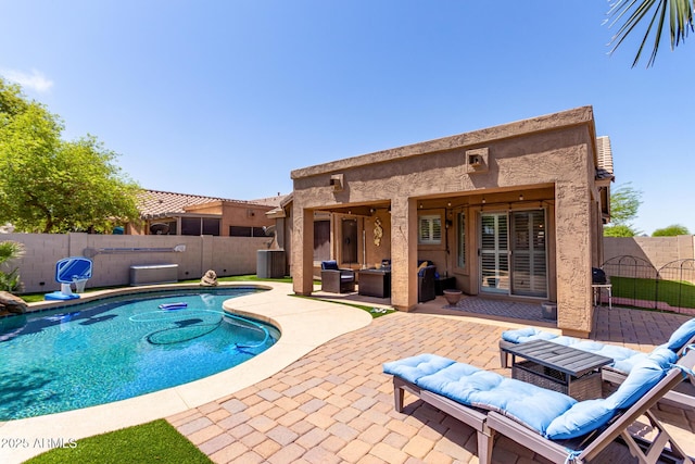 view of swimming pool with a patio area, a fenced backyard, a fenced in pool, and an outdoor hangout area