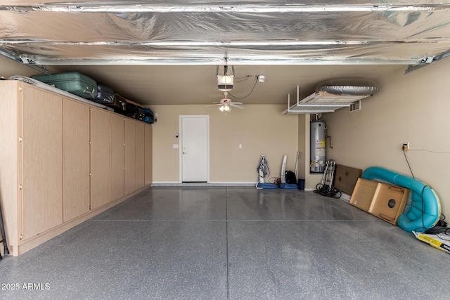 garage with a garage door opener, gas water heater, and visible vents
