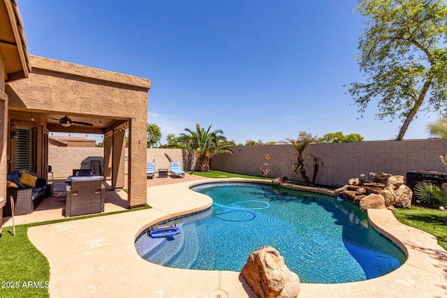 view of pool with a fenced in pool, a patio, a fenced backyard, and a ceiling fan